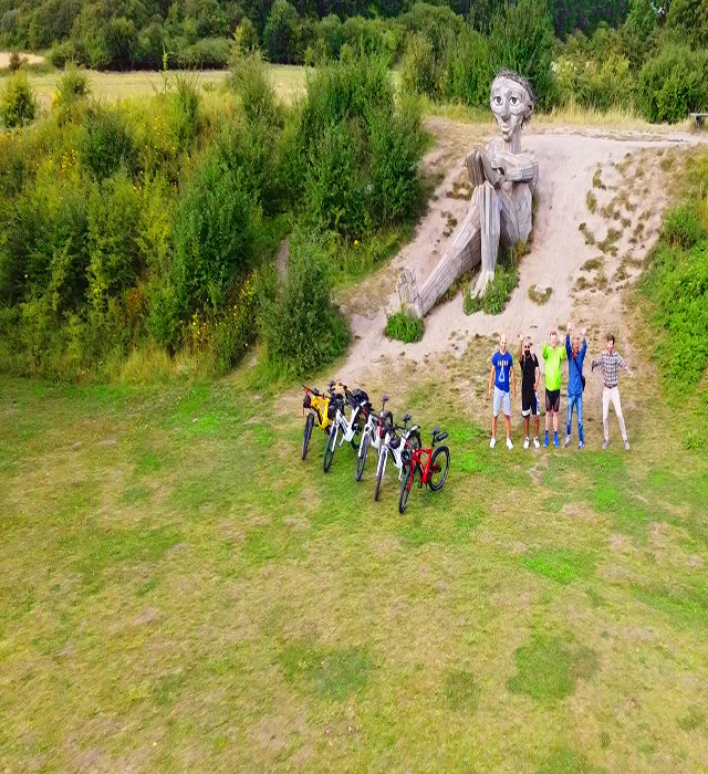 drone to Hill top trine and bikes and group of bikers waving