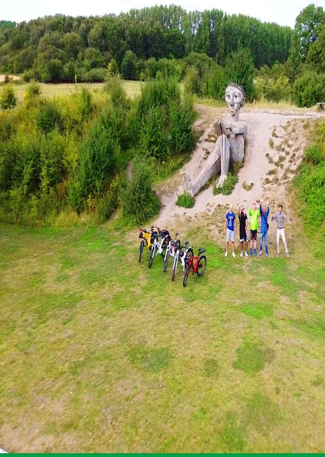 drone to Hill top trine and bikes and group of bikers waving